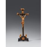An 18th century South German carved wooden crucifixion sceneThe figures carved from boxwood and