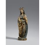 An early 16th century Franconian carved wood figure of Saint BarbaraCarved three-quarters in the