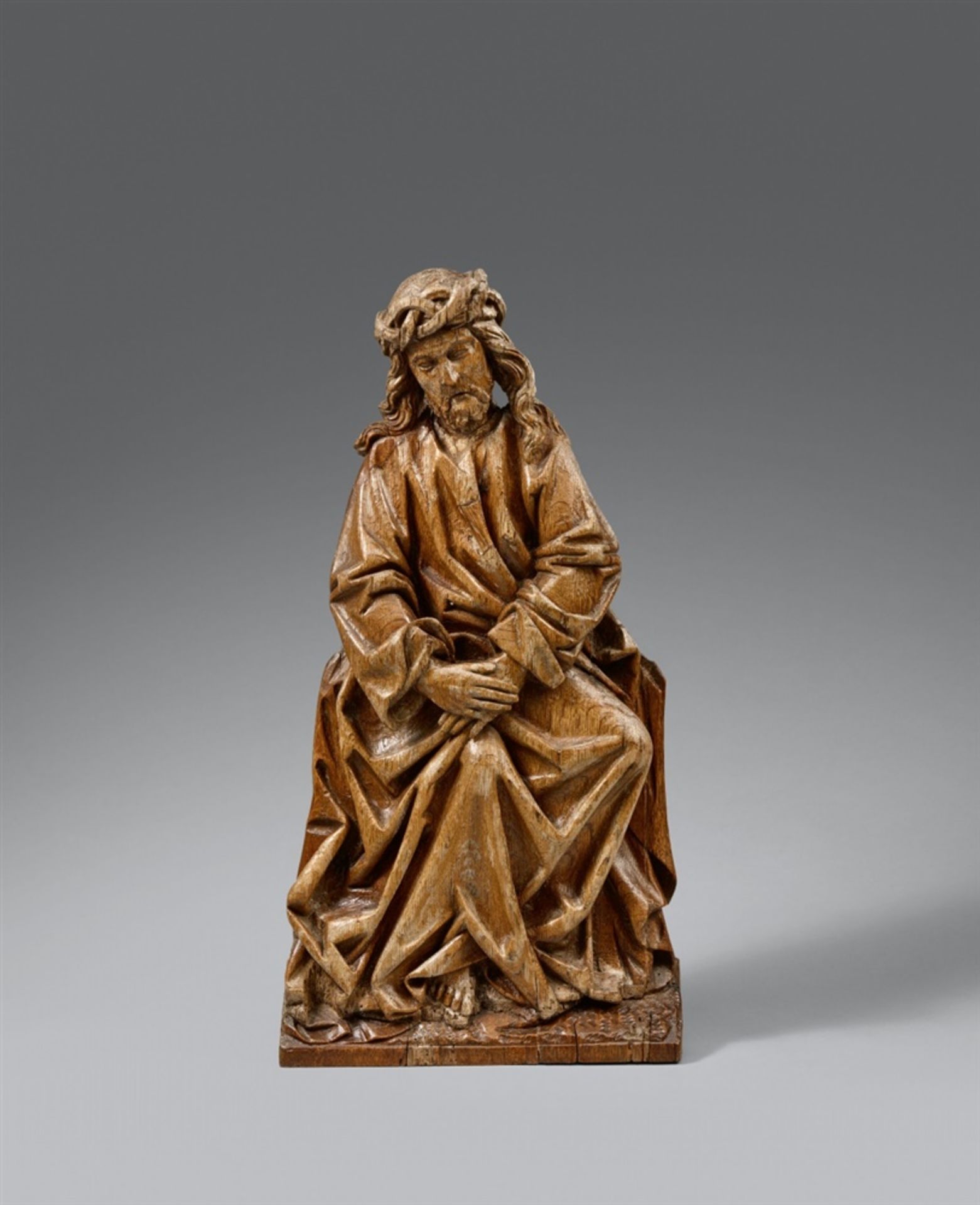 A late 15th century Brabantine carved oak relief with the pensive ChristThe reverse flattened.