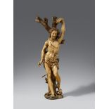 Saint SebastianWooden figure carved in the round and partially freestanding. Remains of older