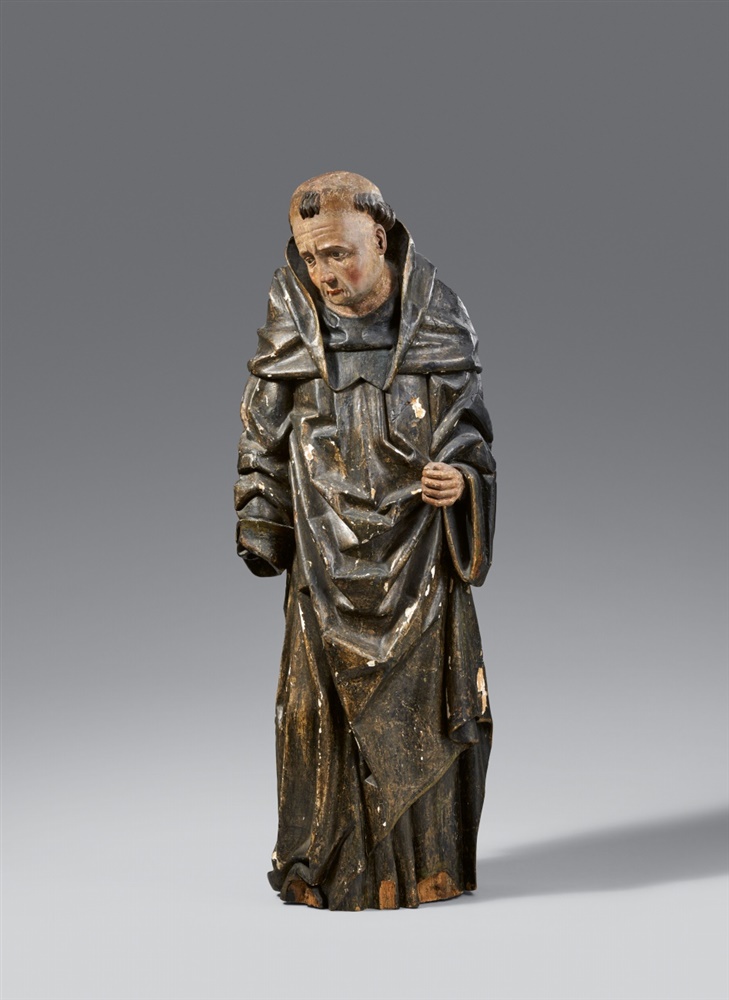 A South Tirolean carved wooden figure of a standing saint (possibly Saint Leonard), around