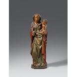A carved wooden figure of the Virgin and Child, Lower Rhine Region, second half 15th centuryCarved