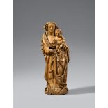A Franconian carved limewood figure of the Virgin and Child, circa 1490/1500Carved three-quarters in