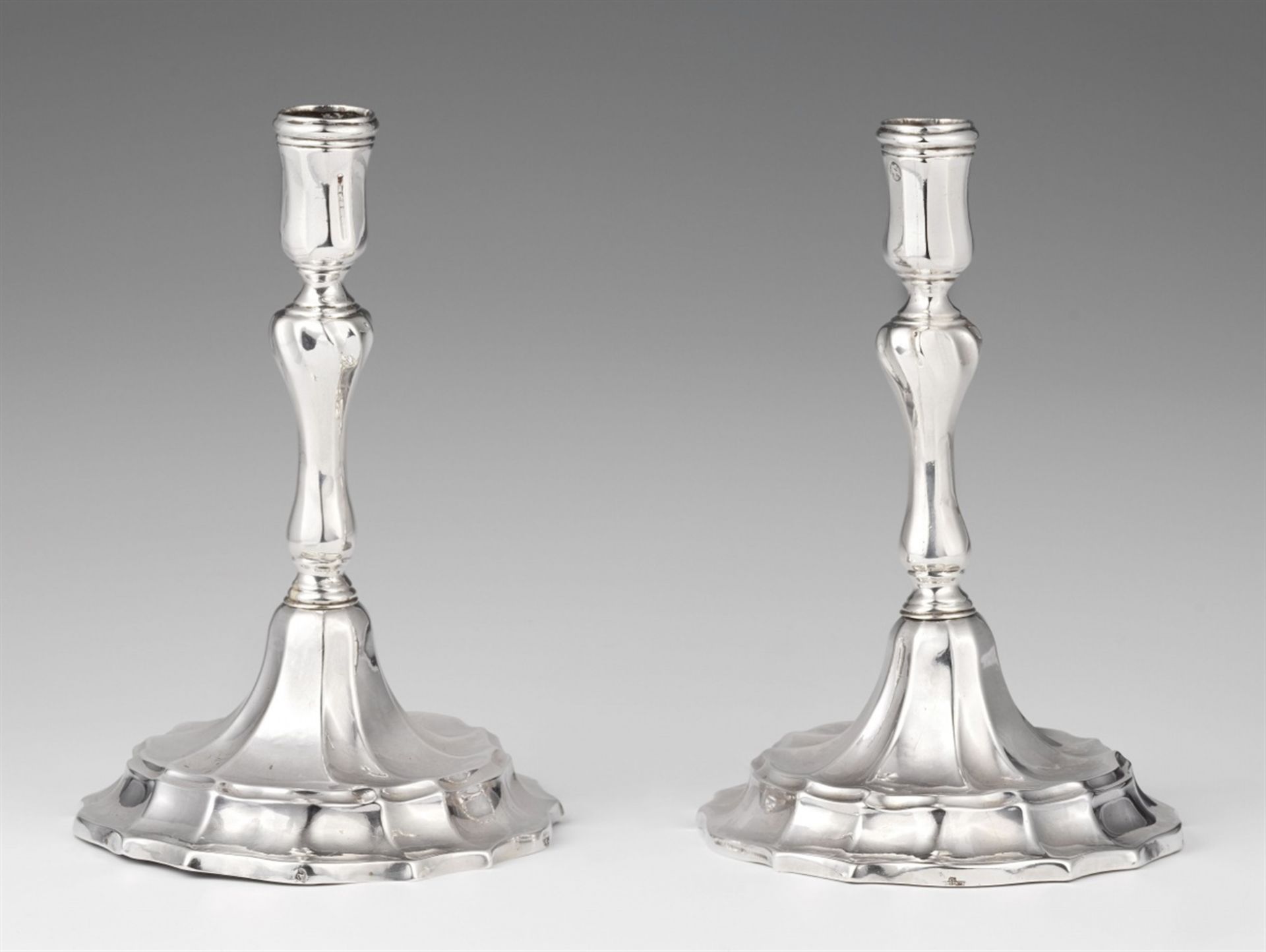 A pair of Spanish silver candlesticksBaluster-form twist fluted shafts issuing from round bases. H