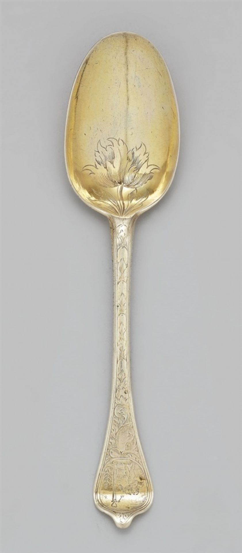 A silver wedding spoonA silver gilt spoon with finely chased acanthus décor, the terminal with a