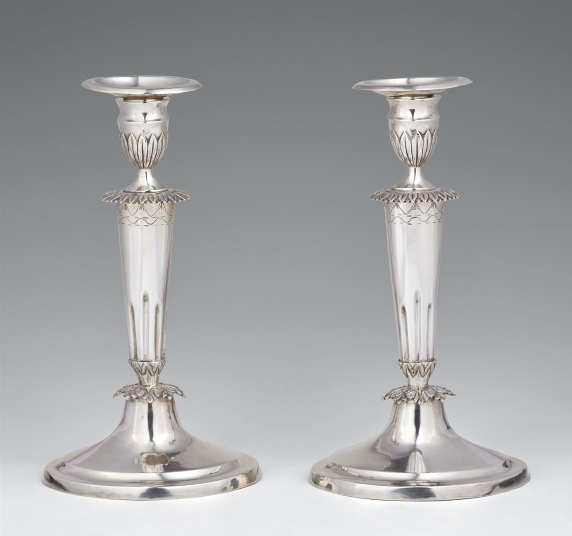 A pair of Mainz silver candlesticksSilver. Tapering column shafts resting on oval bases. Stamps: