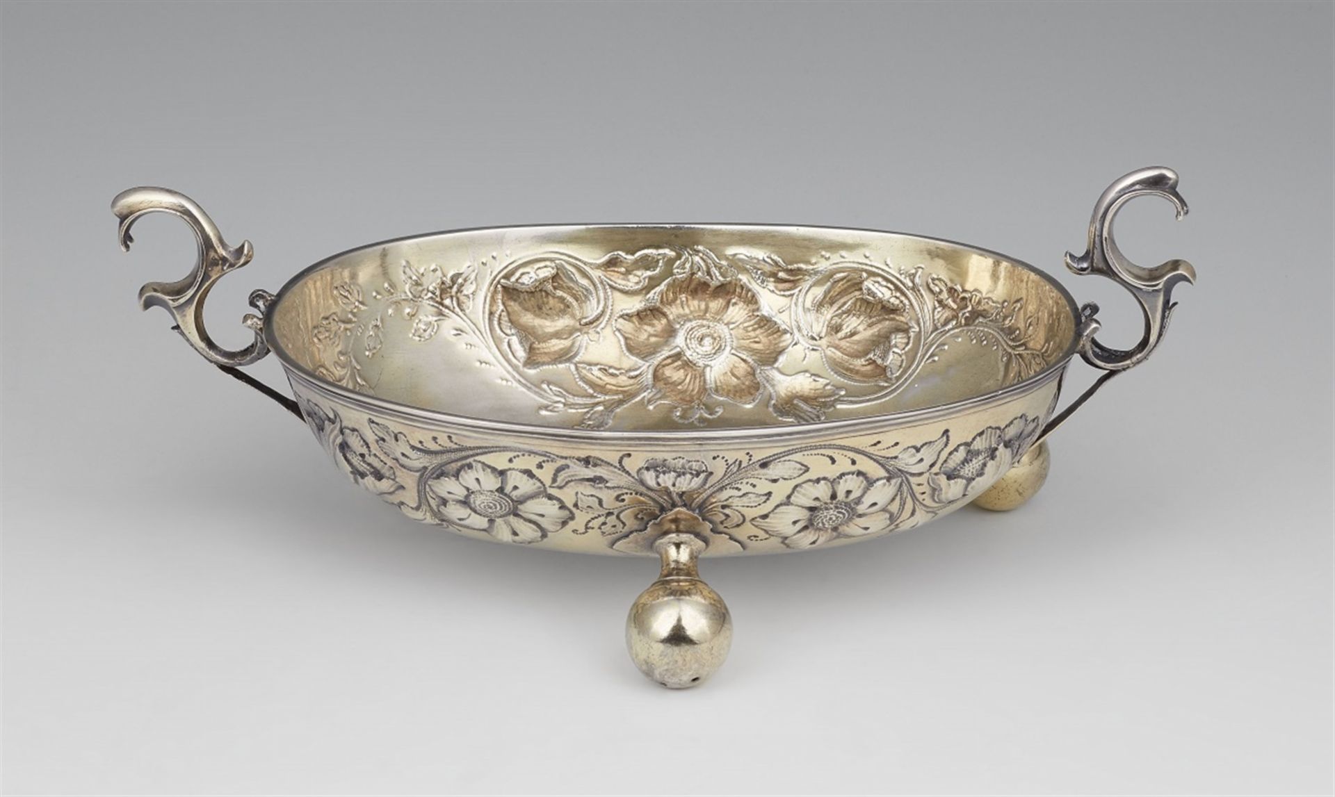 A large Hamburg silver brandy bowlSilver; partly gilded. A parcel-gilt silver bowl on three