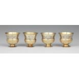 Four Augsburg silver beakersSilver; partly gilded. Parcel-gilt silver beakers with moulded rims