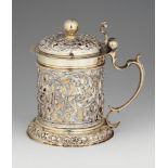 A Baroque silver tankardSilver; partly gilded. Parcel-gilt silver tankard, cylindrical corpus