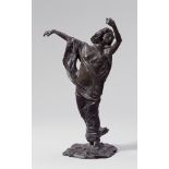 A bronze figure of a veil dancerCast bronze with dark brown patina. Signed at the base of the plinth