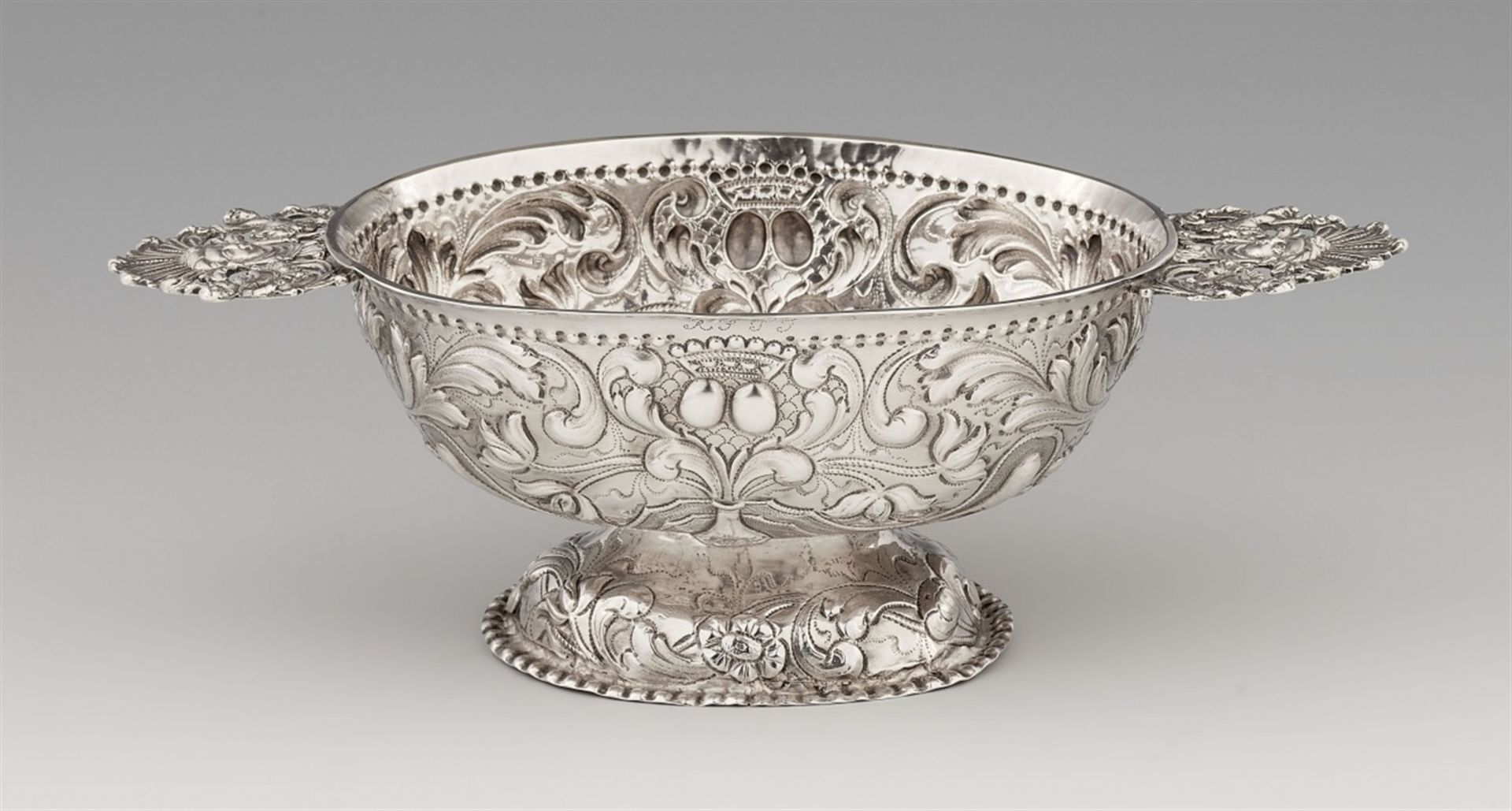 A Sneek silver brandy bowlA deep oval bowl with pierced handles. Decorated with embossed tulips