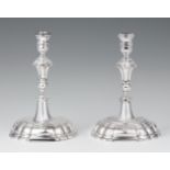 A pair of Lower Saxon silver candlesticksSilver. Baluster-form shafts issuing from square bases.