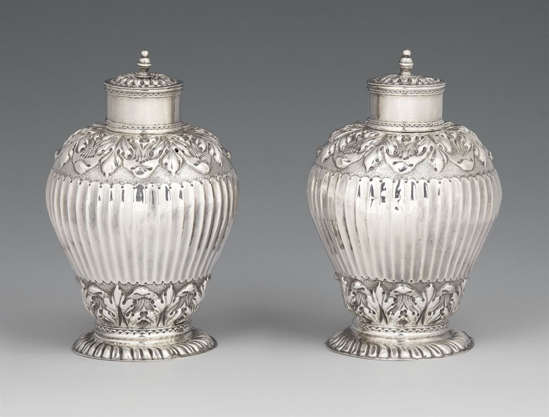 A pair of Haarlem silver tea caddysPear-form vessels with palmette decor on gadrooned bases. Each