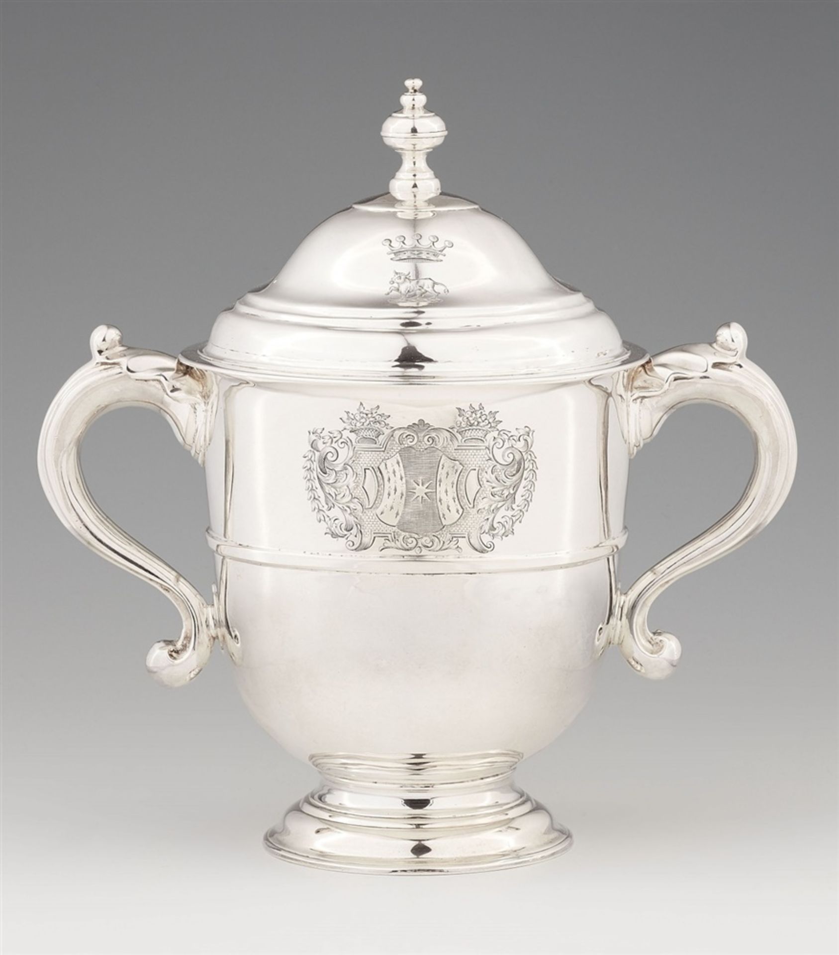 A Queen Anne silver loving cupTapering cylindrical beaker on a waisted foot, the body engraved