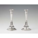 A pair of Empire silver candlesticksSilver. Column shaped candlesticks on hoof feet. Marks: