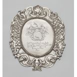 A Sinzig silver official shieldSilver. Oval cartouche form shield with chased règence décor to the