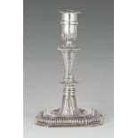 A Hamburg silver candlestickSilver. Square base with gadrooned rim and central hollow with