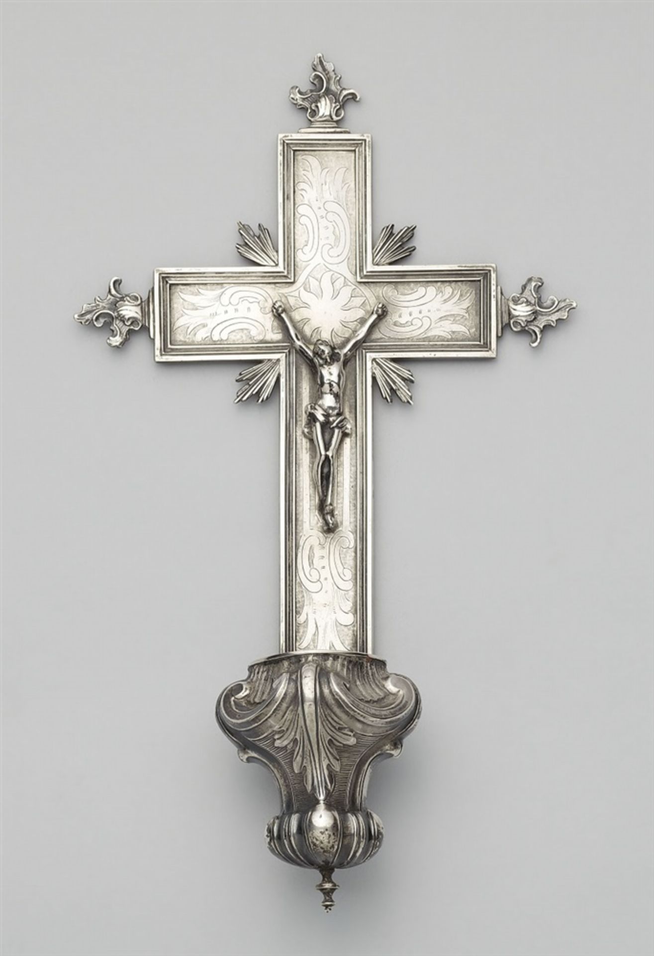 A Mons silver holy water stoopUpper section with a crucifix with the three-dimensional corpus