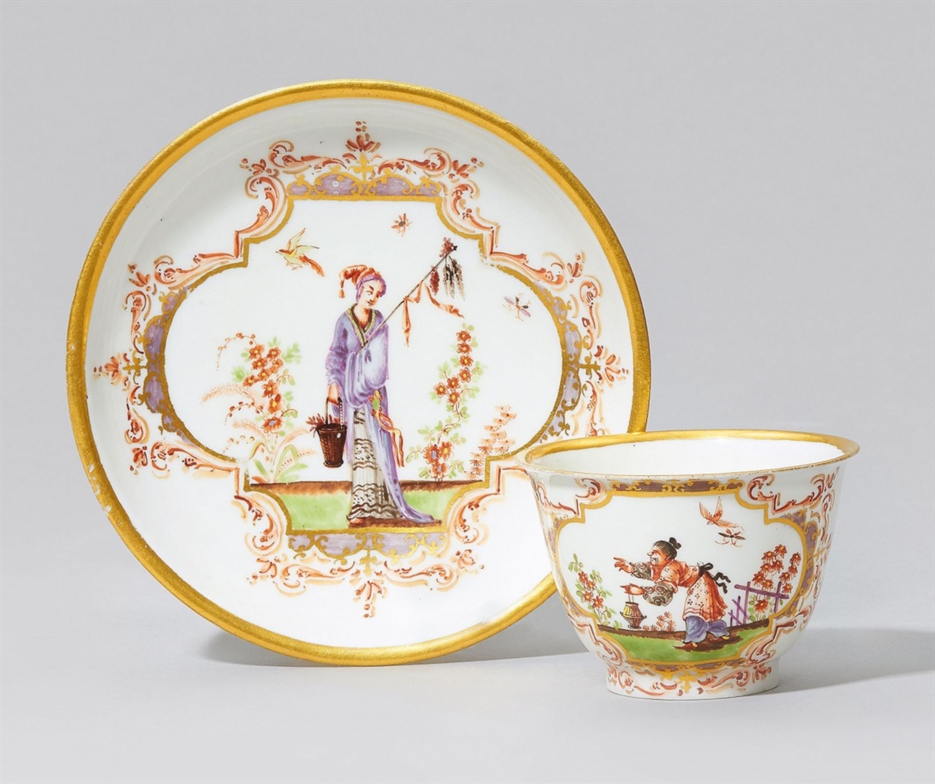An early Meissen porcelain tea bowl and saucer with chinoiserie decorThinly potted tea bowl with