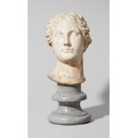 An Italian androgynous white marble bustBust carved in the round in the manner of an ancient Roman