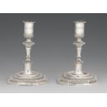 A pair of Halberstadt silver candlesticksSilver. Baluster-form shafts issuing from square