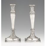 A pair of Weißenfels silver candlesticksSilver. Square bases with lancet décor supporting tapering