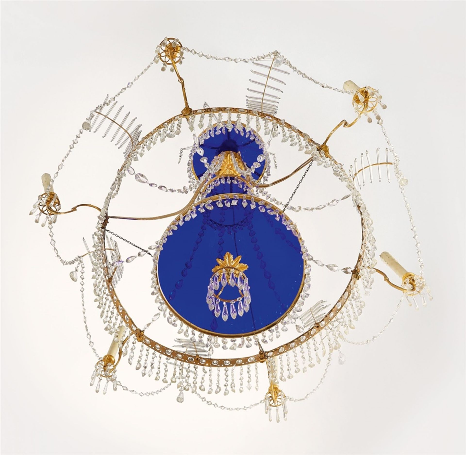 A Neoclassical chandelierOrmolu chandelier with cut glass droplets and blue glass panes. Six