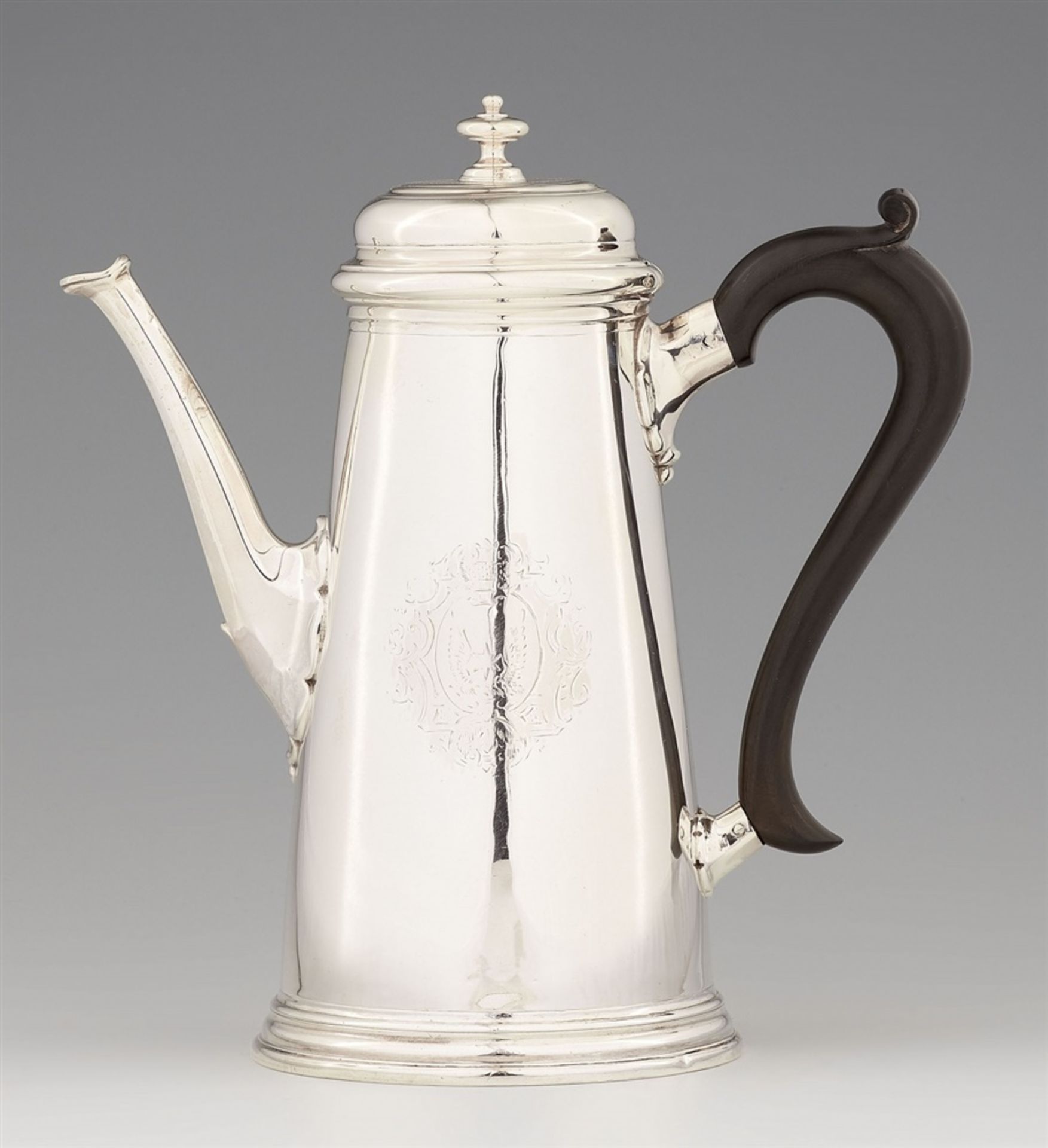 A George II silver coffee potCylindrical coffee pot with a wooden handle and hinged lid, engraved
