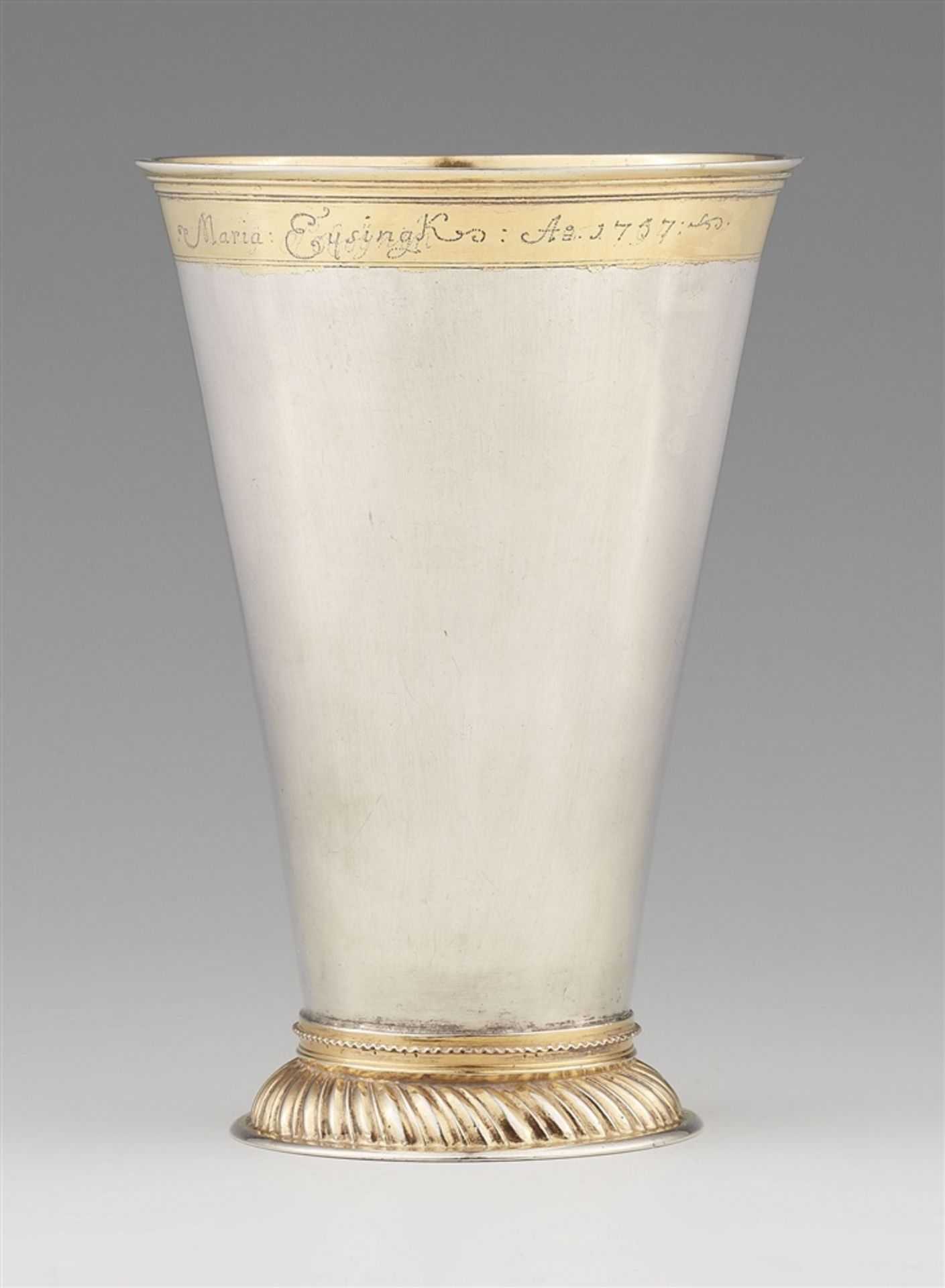A Riga silver beakerParcel-gilt silver beaker on a domed gadrooned base. With owner's engraving