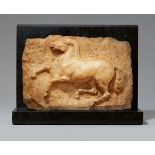 A marble relief of a jumping horsePale yellow marble on a black marble base. H c. 27.5, W c. 40