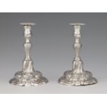 A pair of miniature silver candlesticksSilver Baluster-form shafts with shellwork décor issuing from