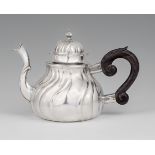 An Augsburg silver teapotSilver Twist fluted pear-form vessel with a carved wooden handle. Brands: