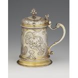 A small Augsburg silver tankardSilver; gold-plated. A silver-gilt tankard of tapering cylindrical
