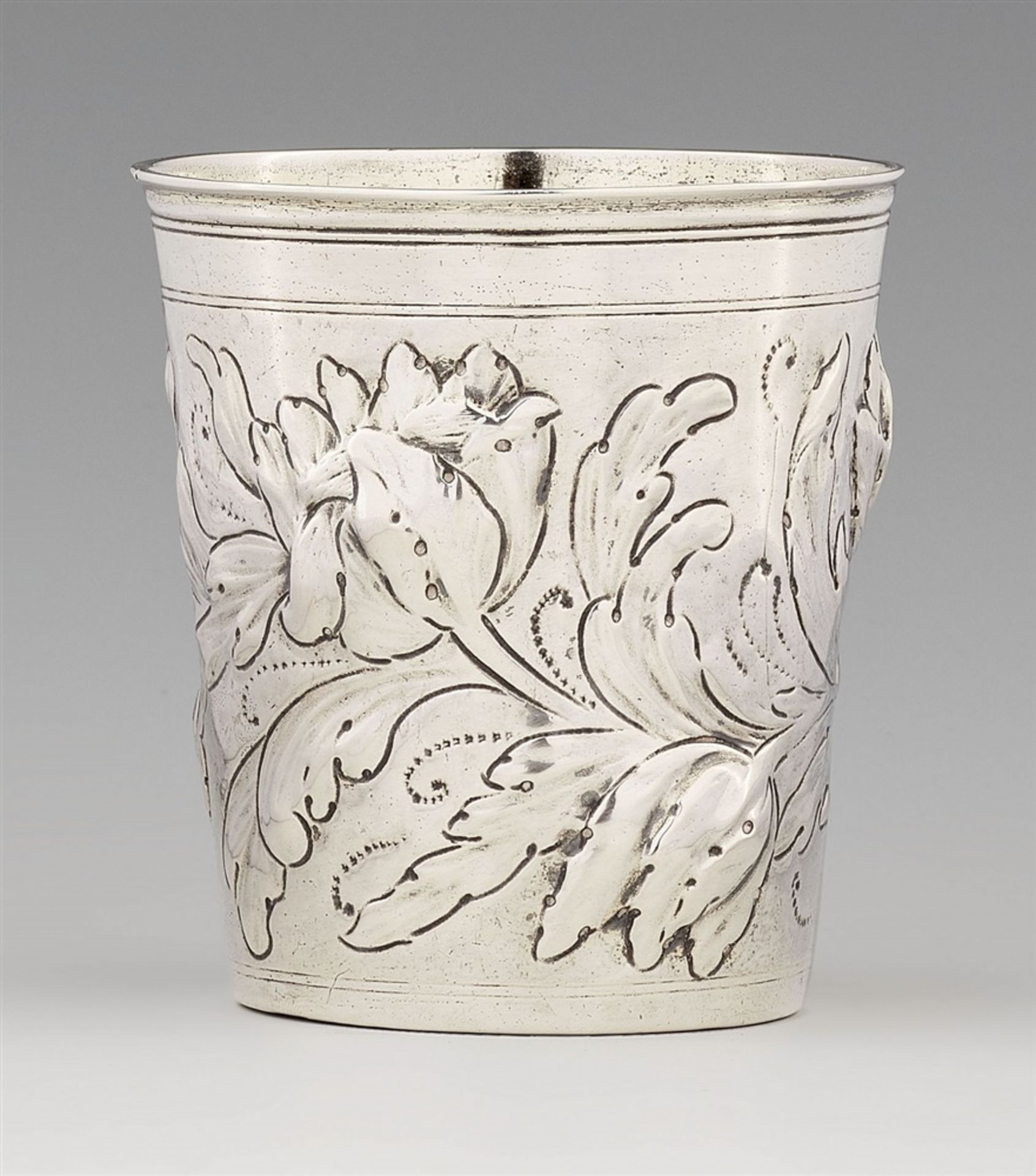 A Nuremberg silver tulip beakerTapering cylindrical beaker with remnants of gilding to the interior,