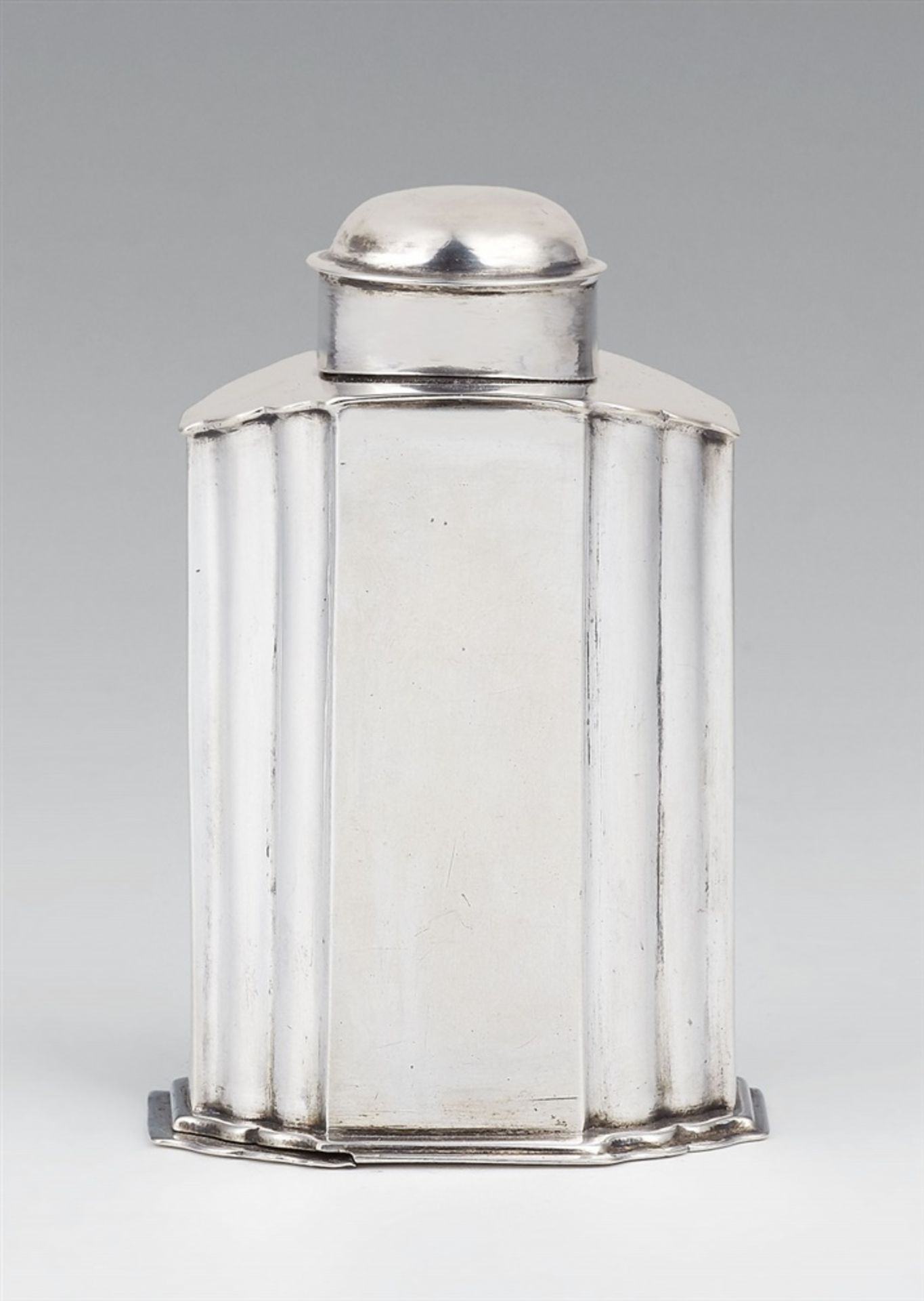 An Augsburg silver tea caddySilver Rectangular caddy with a sliding lock in the underside and a slip