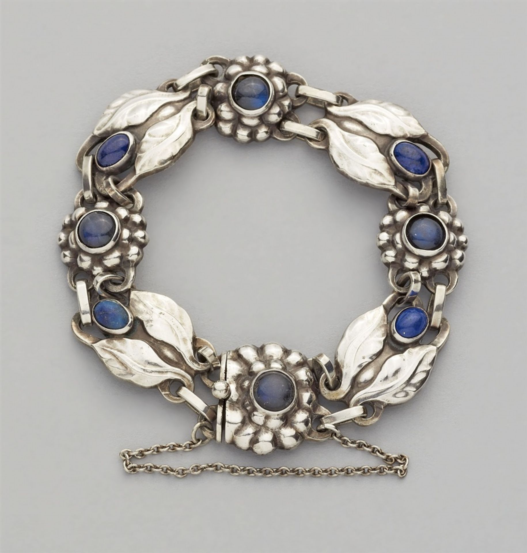A Jugendstil silver bracelet by Georg Jensen, model no. 3A strand of stylised flower and leaf shaped