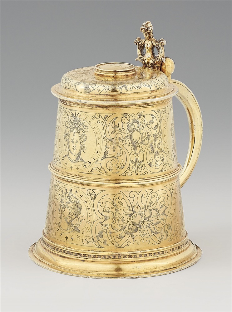 A Renaissance silver tankardSilver-gilt tankard with a smooth base and scrolling handle. With a