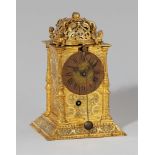 A rare Munich table clockChased brass, cast iron and copper clock. Day running with hourly