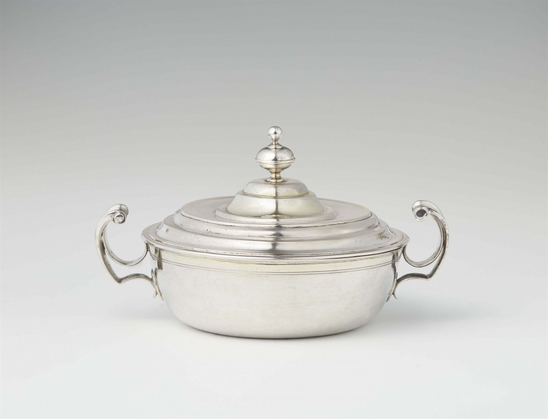 A North Italian parcel gilt silver ecuelleRound dish with curved handles, the stepped slip lid