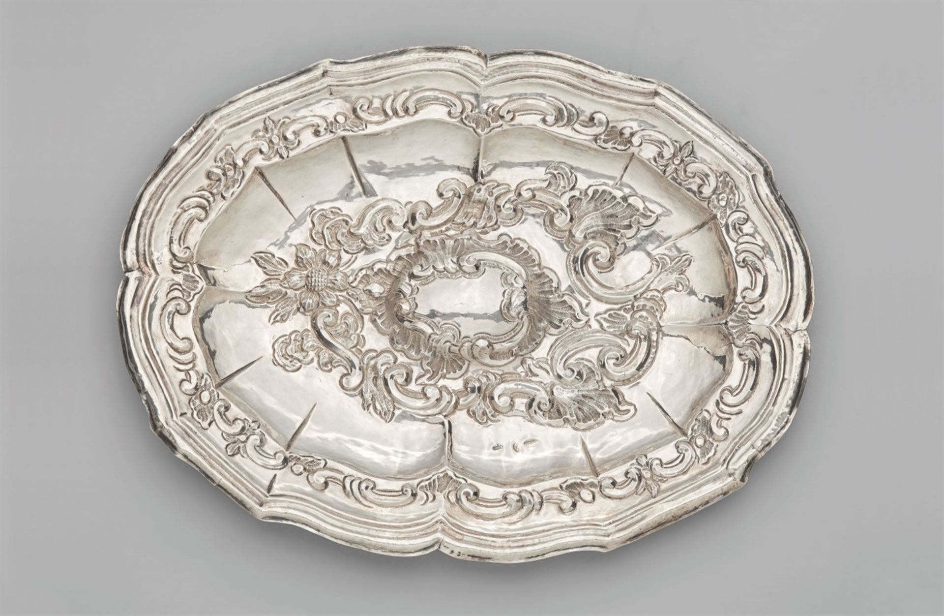 A Guatemalan silver presentoireOval shaped bowl with profiled rim; the slightly arched mirror and