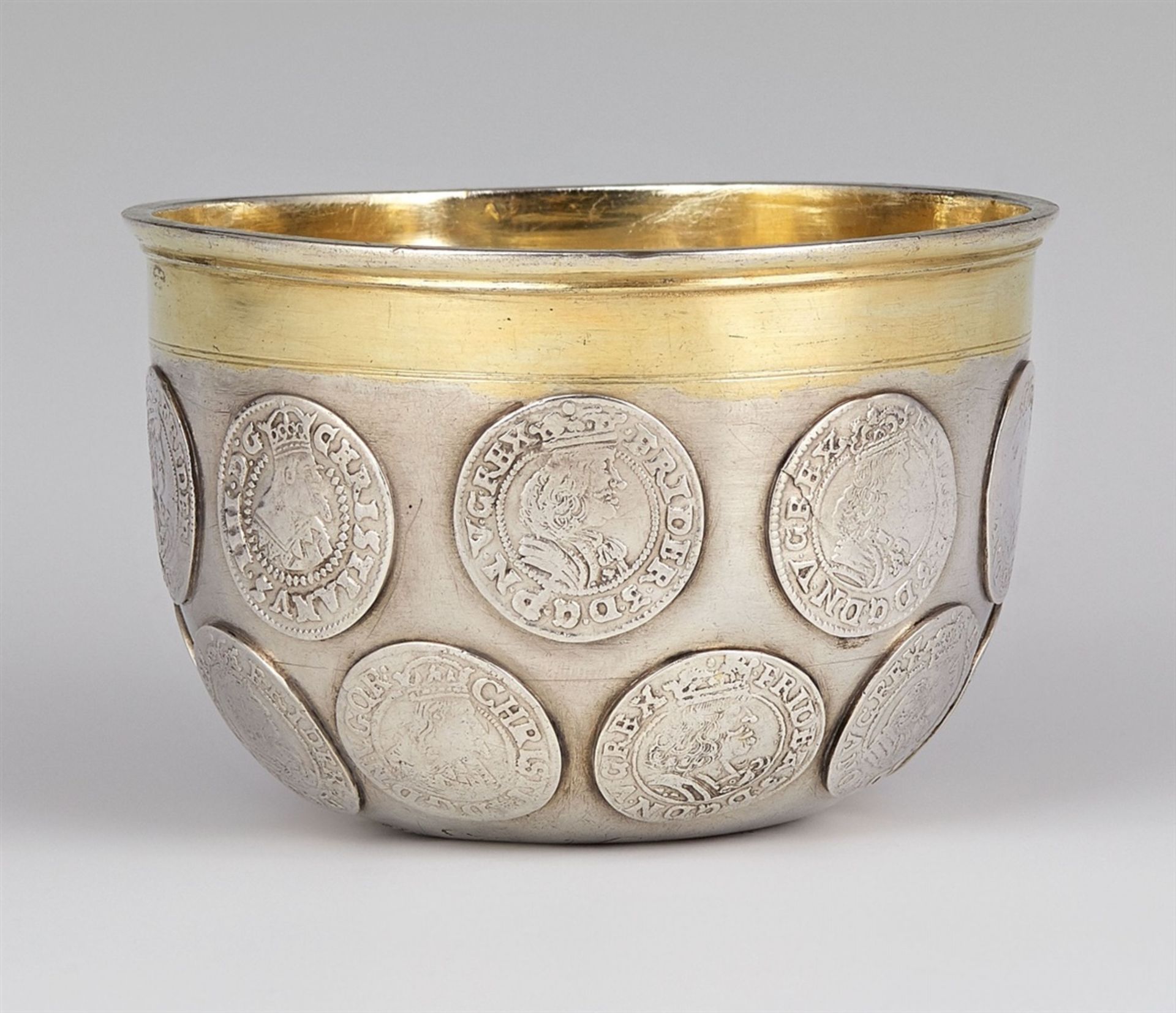 A Copenhagen silver coin beakerA tapering cylindrical beaker on a slightly domed base. Inset