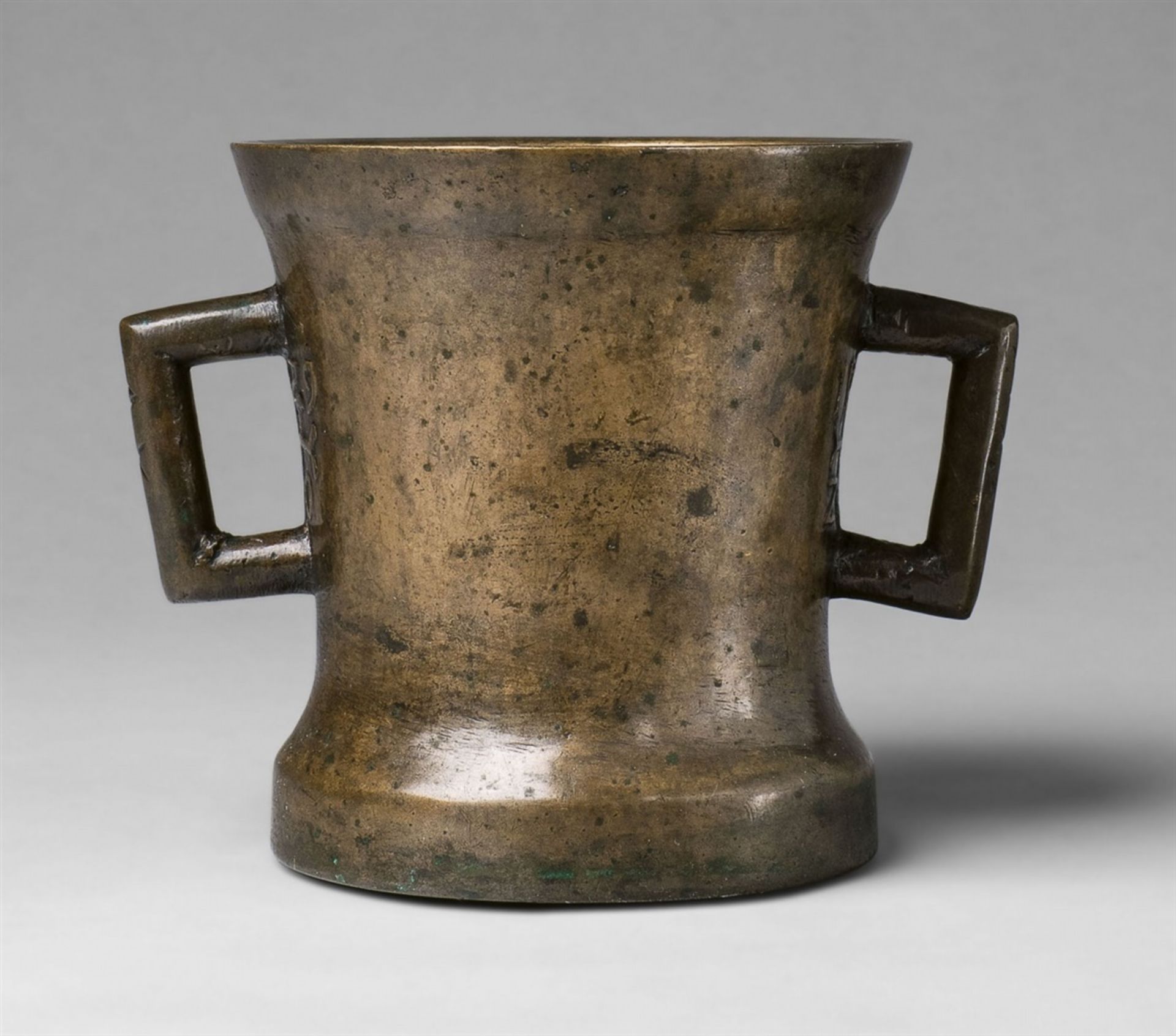 An early mortar dated 1529Golden brown cast bronze with natural patina. Cylindrical form on a