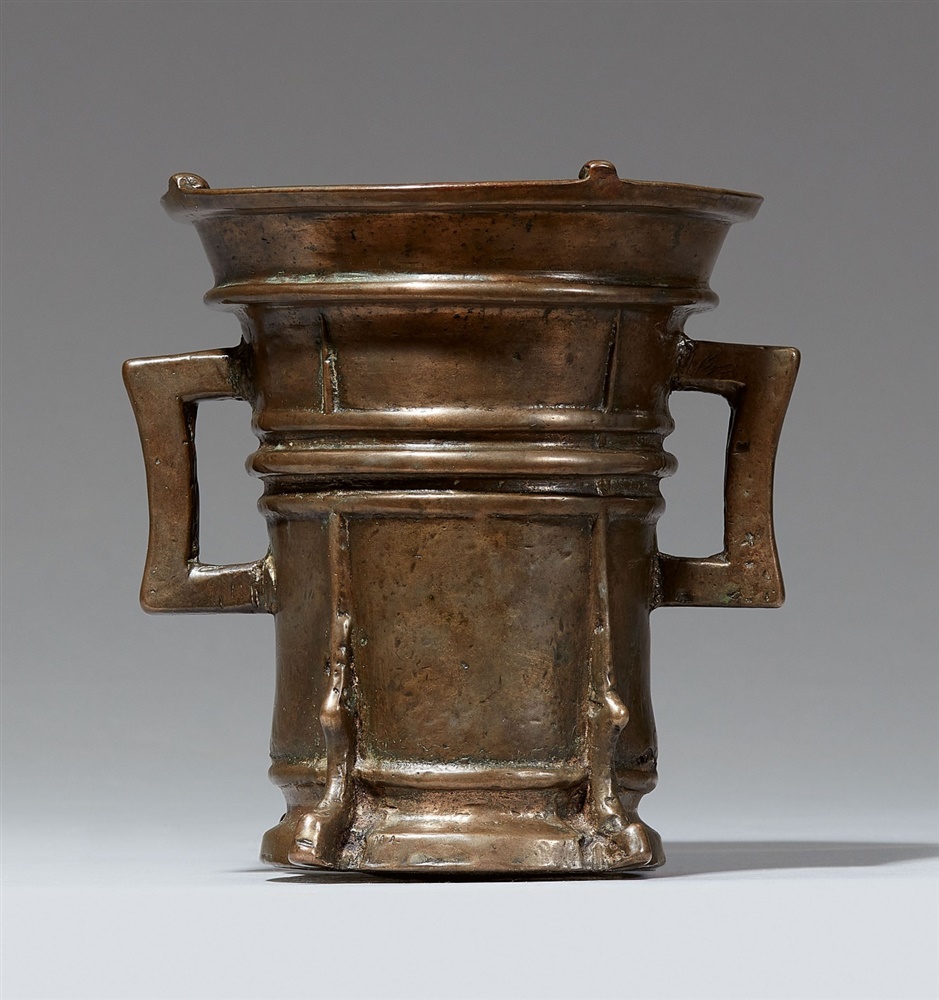 A Gothic two-handled mortar with a T-shaped pestleCast bronze with golden brown patina. Of