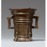 A Gothic two-handled mortar with a T-shaped pestleCast bronze with golden brown patina. Of