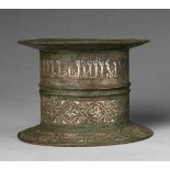 An important Islamic mortarChased cast bronze with silver and copper damascening. Of cylindrical