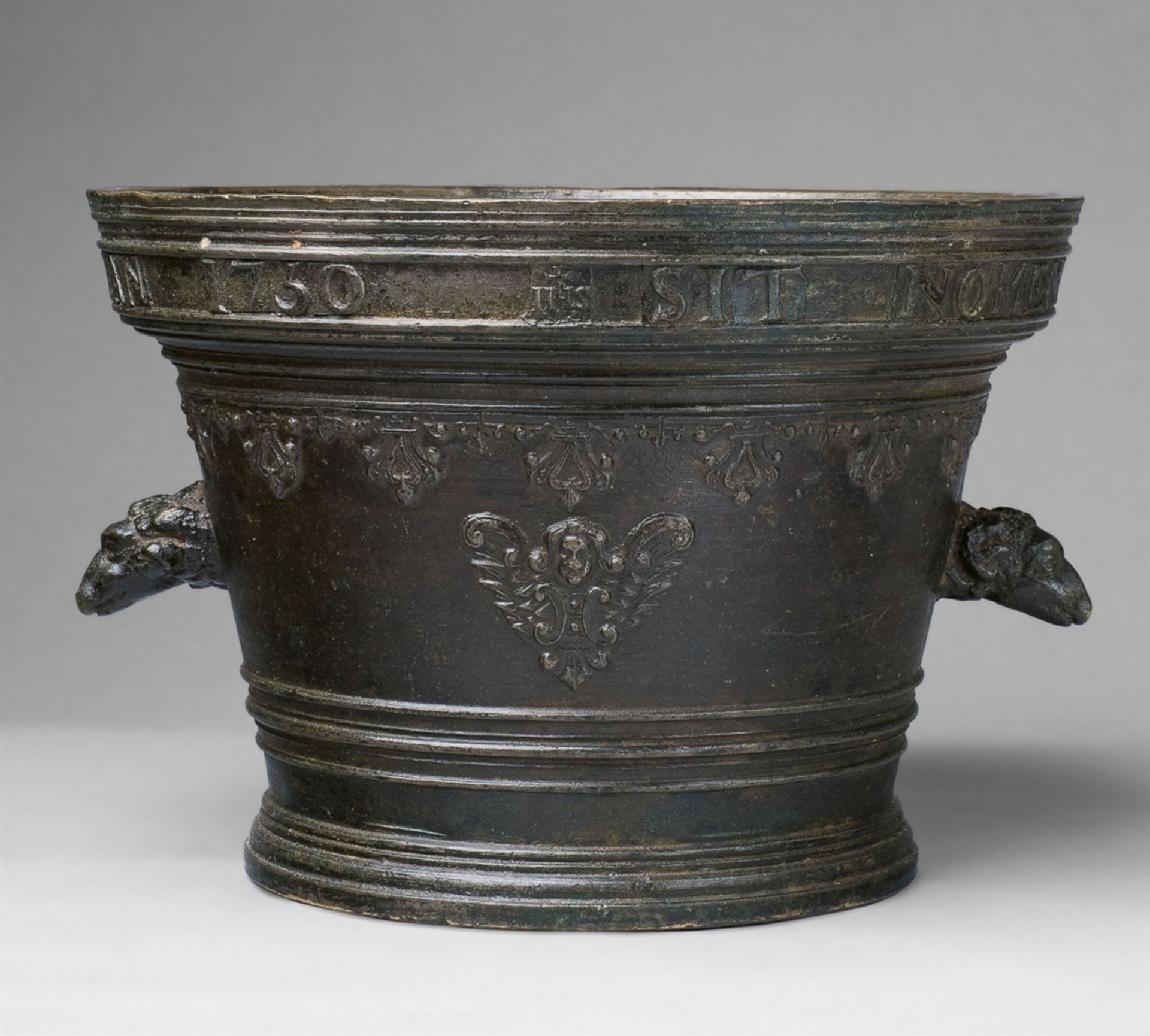 A large French monastery mortar with ram's head handlesCast bronze with dark brown patina. Of squat,