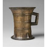 An early North German one-handled mortarCast bronze with golden brown patina. Of cylindrical form