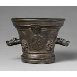 An unusual mortar with dog's head handlesGolden brown cast bronze with dark brown patina. Richly