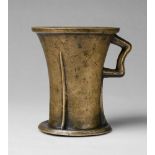 A Gothic one-handled mortarCast bronze with slightly mottled golden brown patina. Tapering form on a