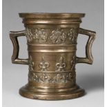 A rare mortar with fleur-de-lys motifsThick golden brown cast bronze with polished natural patina.